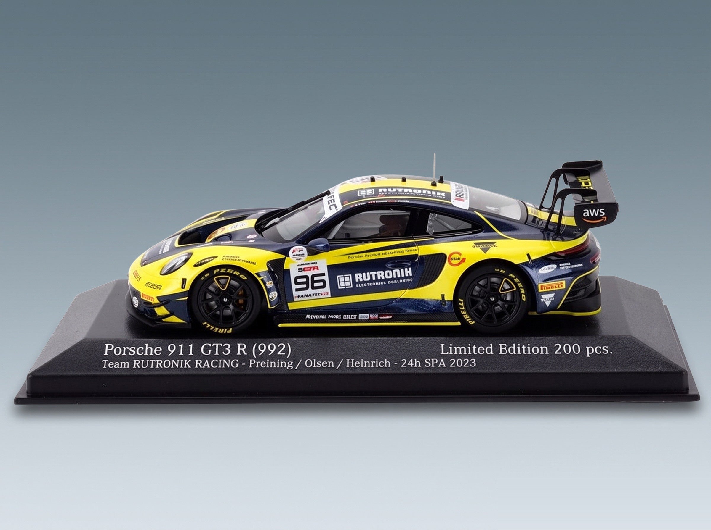 Porsche 911 992 GT3 R Rutronik Racing No. 96 5th 24h Spa 2023 Thomas Preining Laurent Heinrich Dennis Olsen Minichamps 1:43 scale model - front three-quarter view on display base