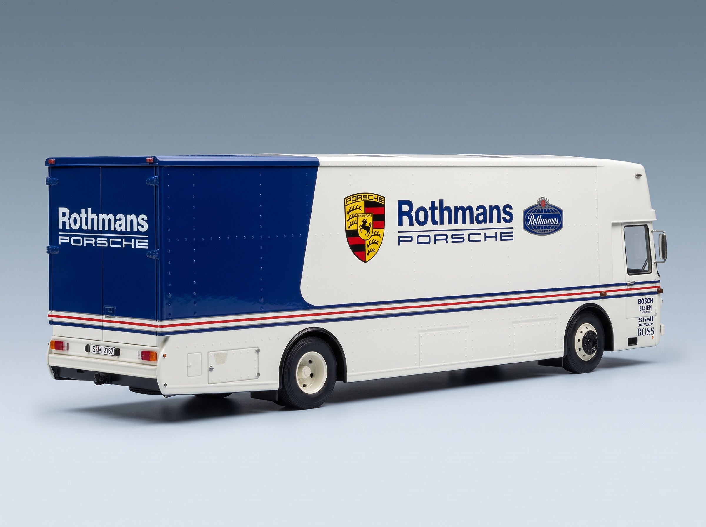 Mercedes-Benz O317 Truck Car Transporter Porsche Rothmans 1984 White Blue Schuco 1:18 scale model - rear three-quarter view
