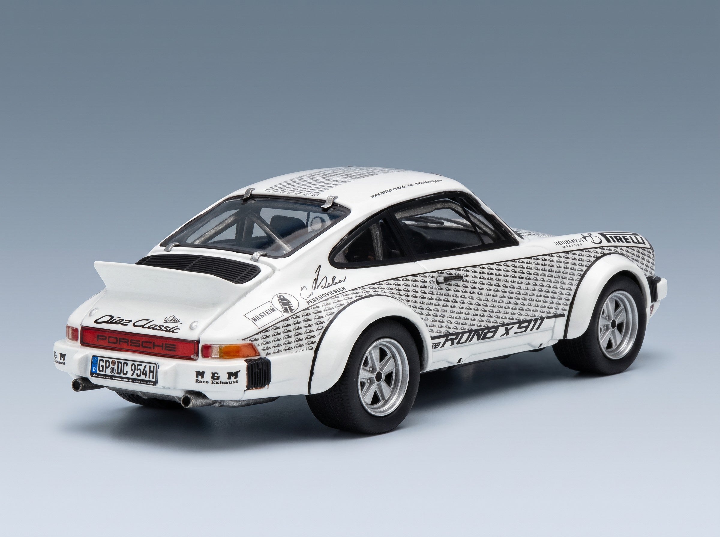 Porsche 911 Coupé Walter Röhrl 1969 White Black Schuco 1:43 scale model - rear three-quarter view