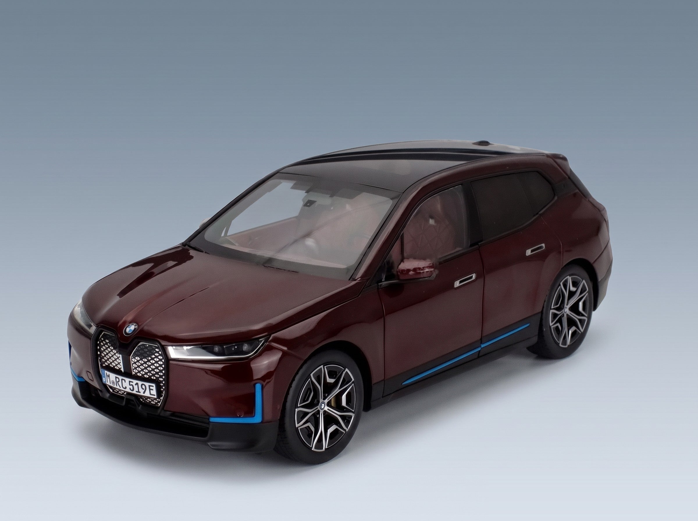 BMW iX SUV 2023 Red Minichamps 1:18 scale model - front three-quarter view