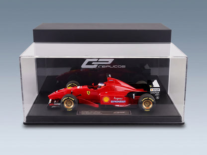 Ferrari F310 No. 1 Michael Schumacher Winner Spanish GP 1996 with Driver GP Replicas 1:18 scale model - side view in display case