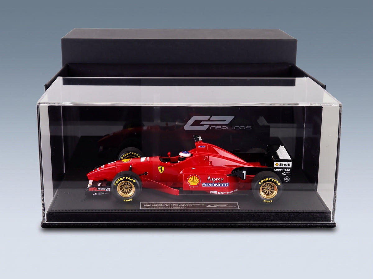 Ferrari F310 No. 1 Michael Schumacher Pole Position Monaco GP 1996 with Driver GP Replicas 1:18 scale model - side view in display case