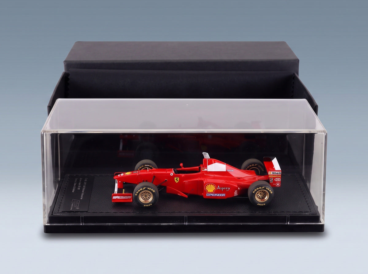 Ferrari F310B No. 5 Michael Schumacher Winner Japanese GP 1997 GP Replicas 1:43 scale model - side view in display case