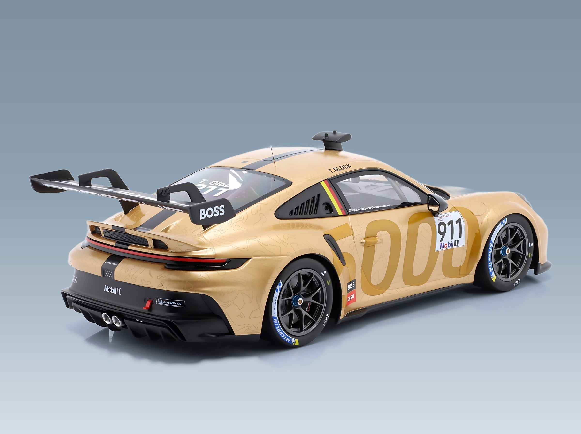 Porsche 911 992 GT3 Cup Porsche Motorsport No. 911 Timo Glock Porsche Supercup Hungaroring 2023 IXO Models 1:18 scale model - rear three-quarter view