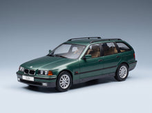 BMW 3-Series 325i Touring SW 1995 Dark Green Metallic MCG 1:18 scale model - front three-quarter view