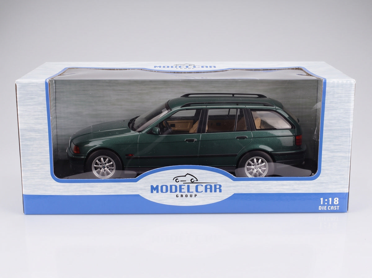BMW 3-Series 325i Touring SW 1995 Dark Green Metallic MCG 1:18 scale model - original packaging