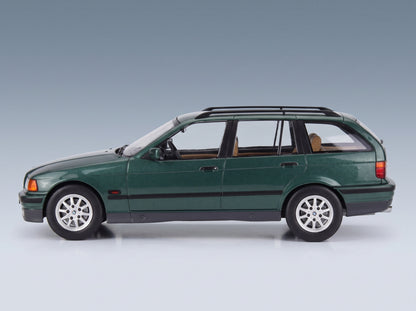 BMW 3-Series 325i Touring SW 1995 Dark Green Metallic MCG 1:18 scale model - side view