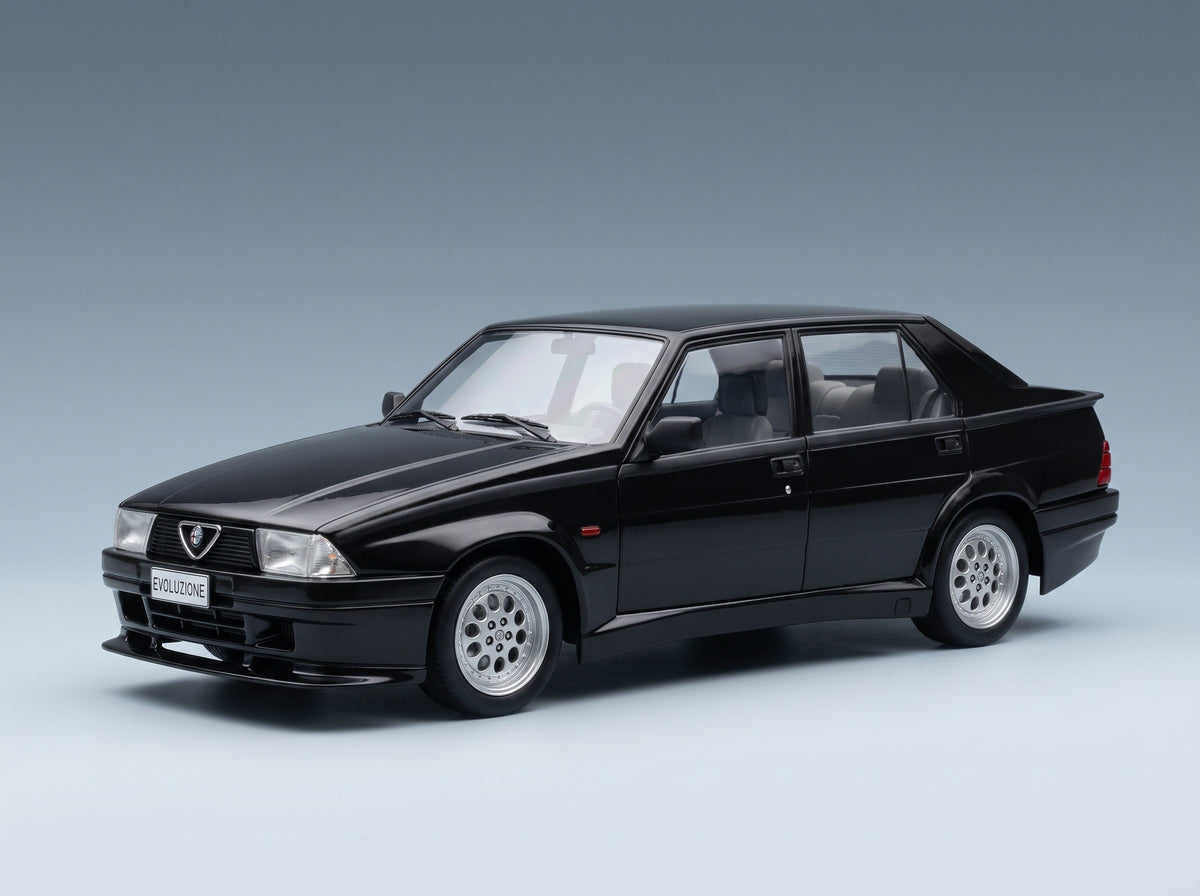 Alfa Romeo 75 Turbo Evoluzione 1987 Black MCG 1:18 scale model - front three-quarter view