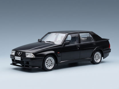 Alfa Romeo 75 Turbo Evoluzione 1987 Black MCG 1:18 scale model - front three-quarter view