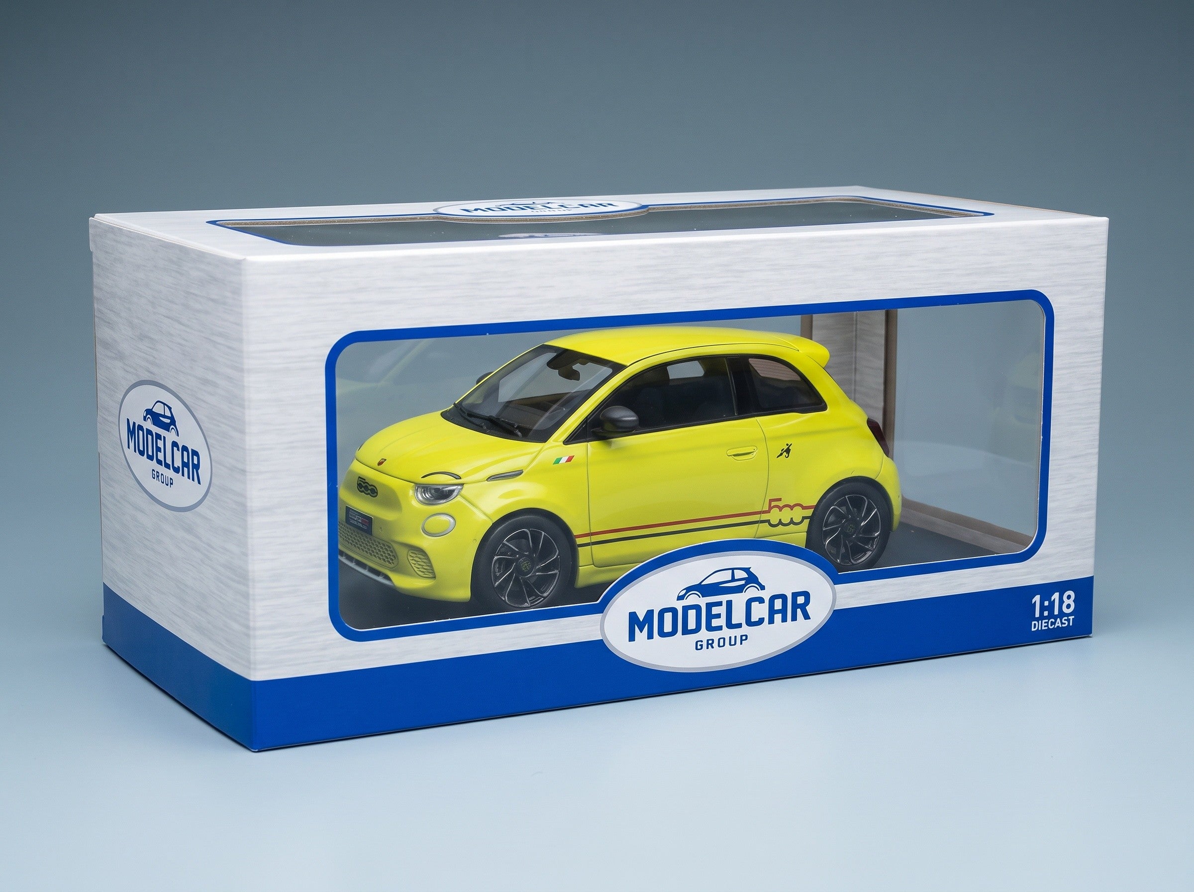 Fiat 500e Abarth 2024 Yellow MCG 1:18 scale model - original packaging