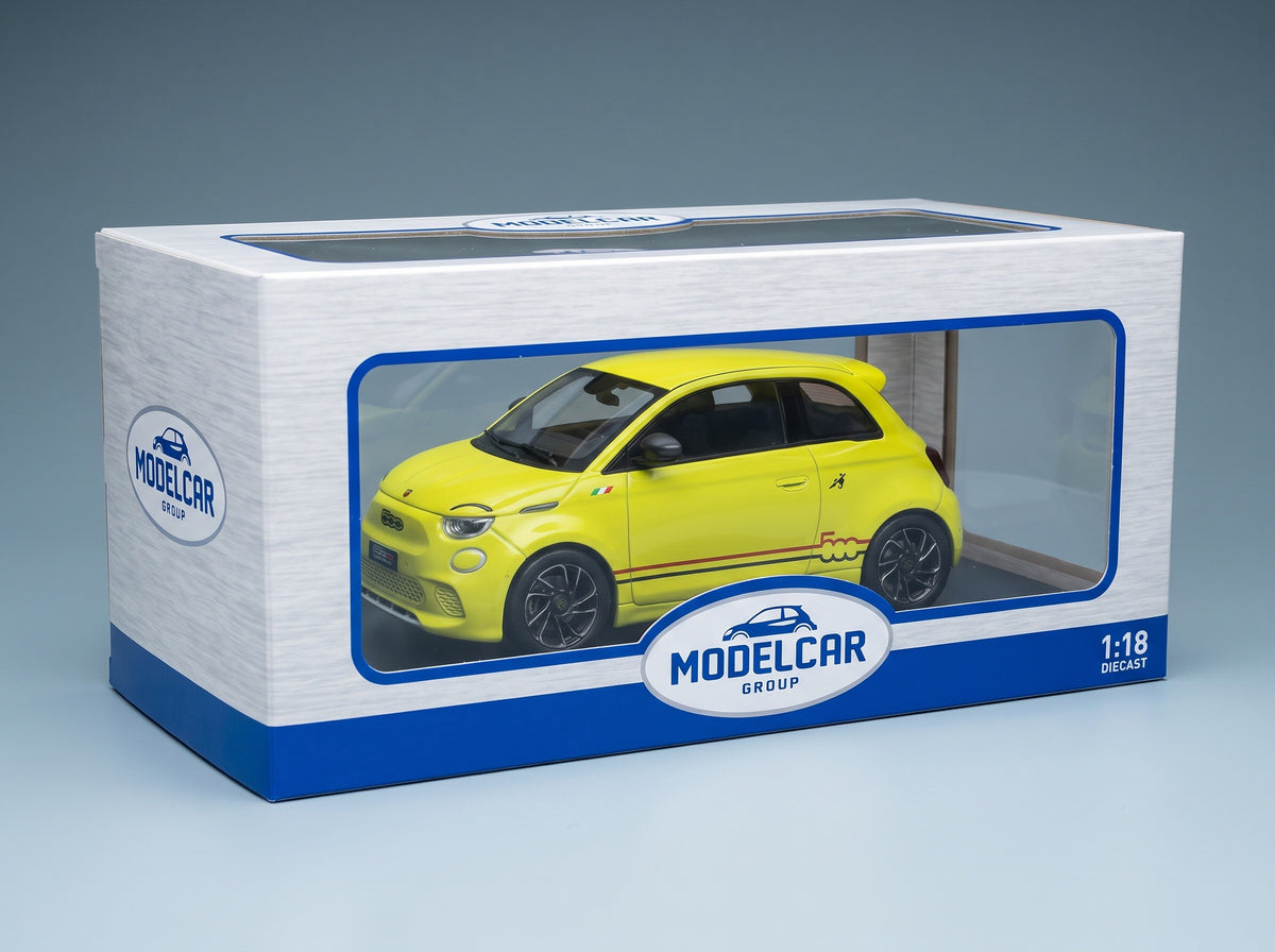 Fiat 500e Abarth 2024 Yellow MCG 1:18 scale model - original packaging