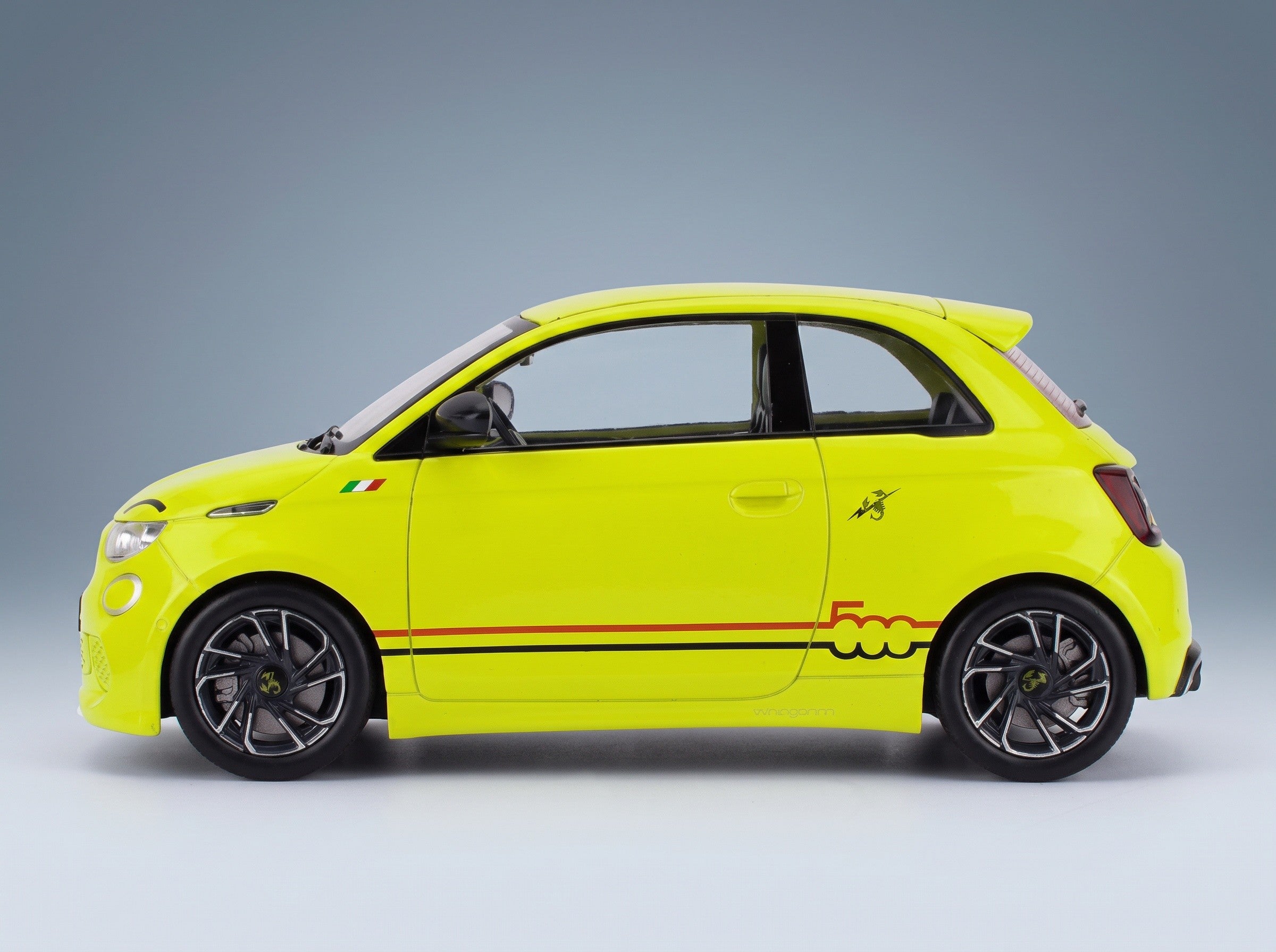 Fiat 500e Abarth 2024 Yellow MCG 1:18 scale model - side view