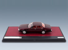De Tomaso Deauville 2-Series 1983 Red Metallic Matrix Scale Models 1:43 scale model - side view on display base