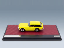 Triumph TR6 Shooting Brake Station Wagon 1974 Yellow Matrix Scale Models 1:43 scale model - side view on display base