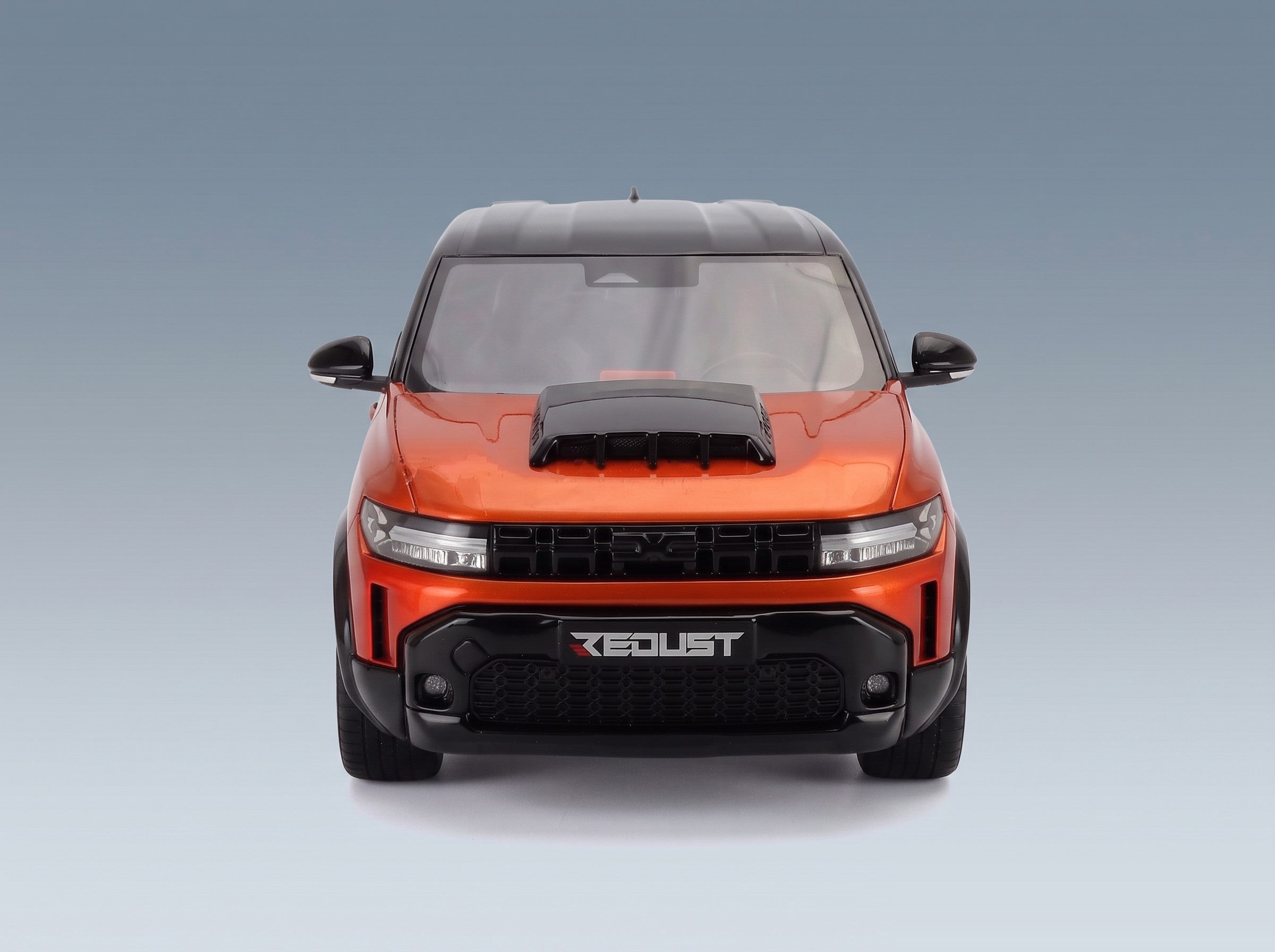Dacia Duster Redust Sport 4x2 Hybrid 2025 Orange Otto-Mobile 1:18 scale model - front view