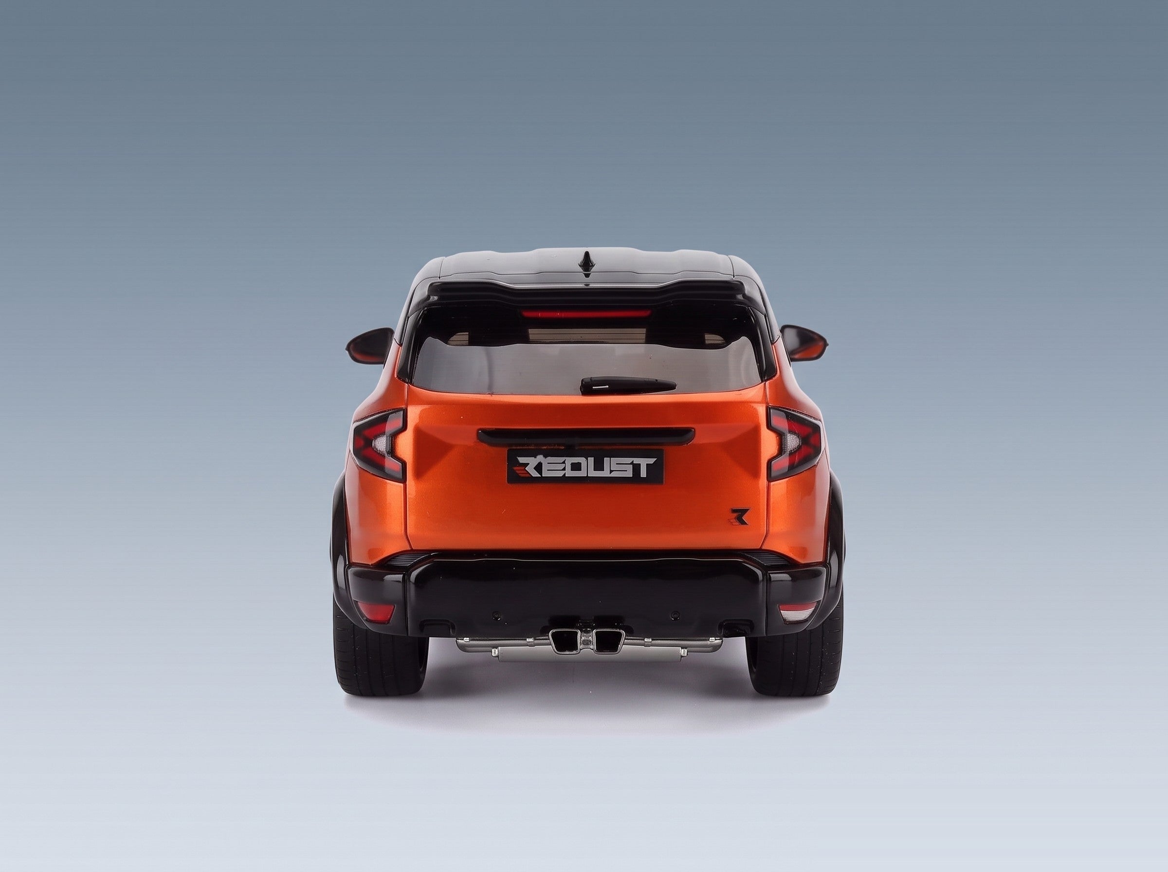 Dacia Duster Redust Sport 4x2 Hybrid 2025 Orange Otto-Mobile 1:18 scale model - rear view