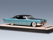 Cadillac De Ville Cabriolet Closed 1967 Capri Aqua Metallic Black Stamp Models 1:43 scale model - rear three-quarter view
