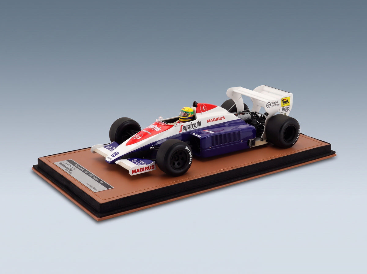 Toleman TG184 Hart No. 19 Ayrton Senna British GP 3rd 1984 with Driver Tecnomodel 1:18 scale model - front three-quarter view on display base