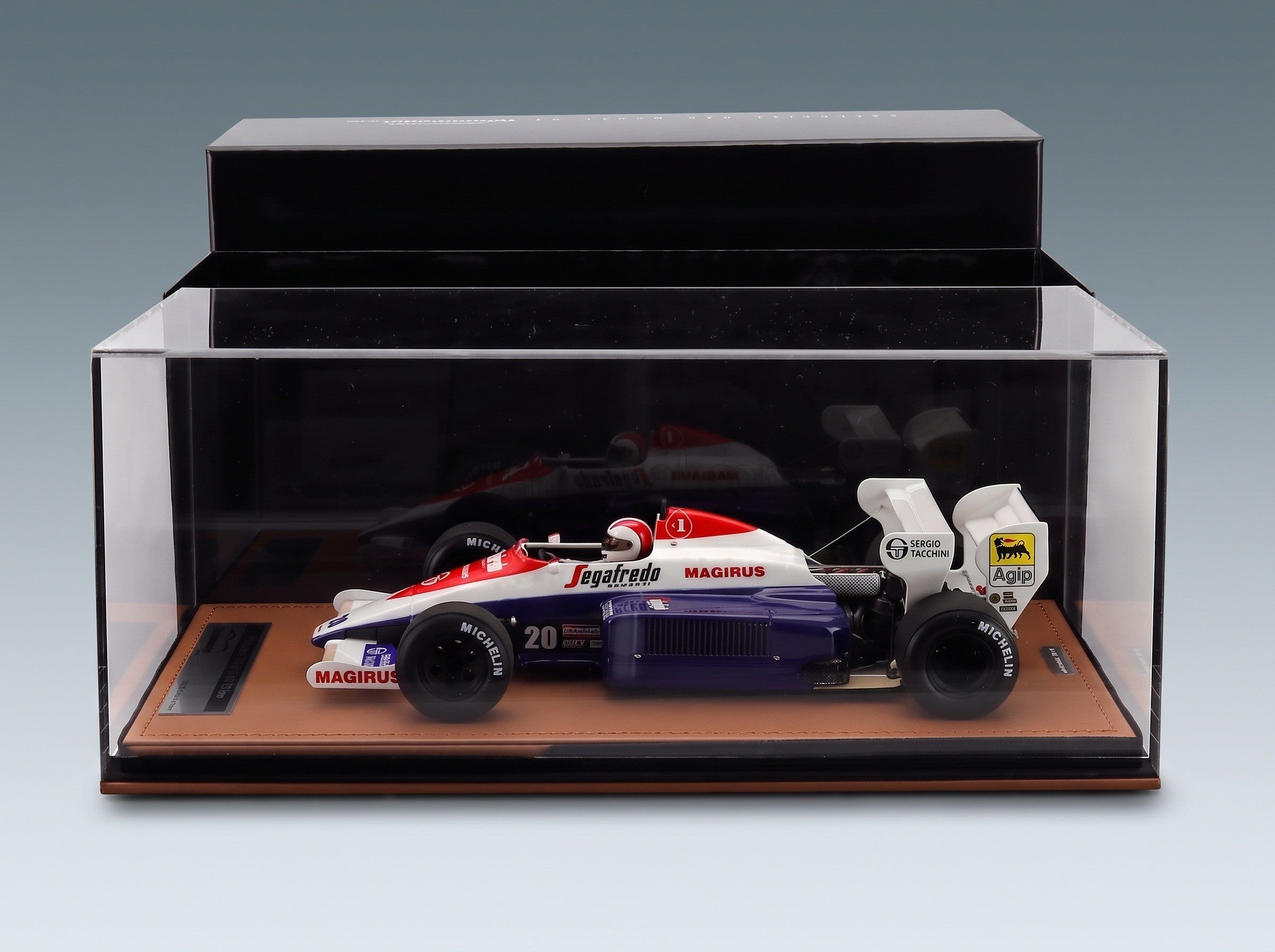 Toleman TG184 Hart Turbo Toleman Group Motorsport No. 20 Johnny Cecotto Dallas GP 1984 with Driver Tecnomodel 1:18 scale model - side view in display case