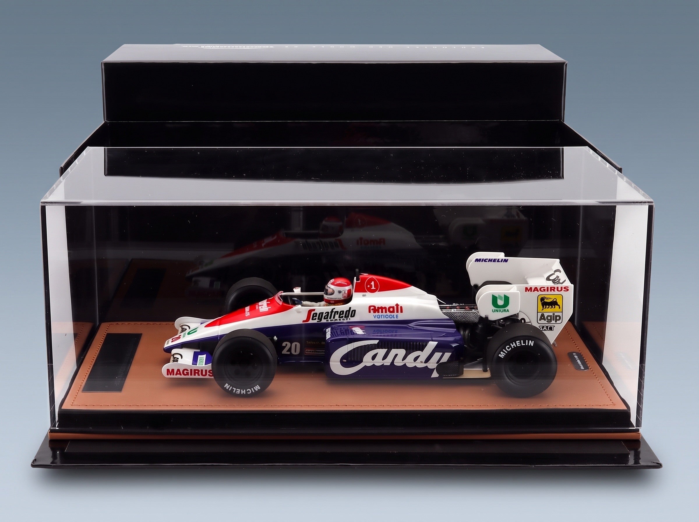 Toleman TG184 Hart No. 20 Pierluigi Martini Practice Italian GP 1984 with Driver Tecnomodel 1:18 scale model - side view in display case