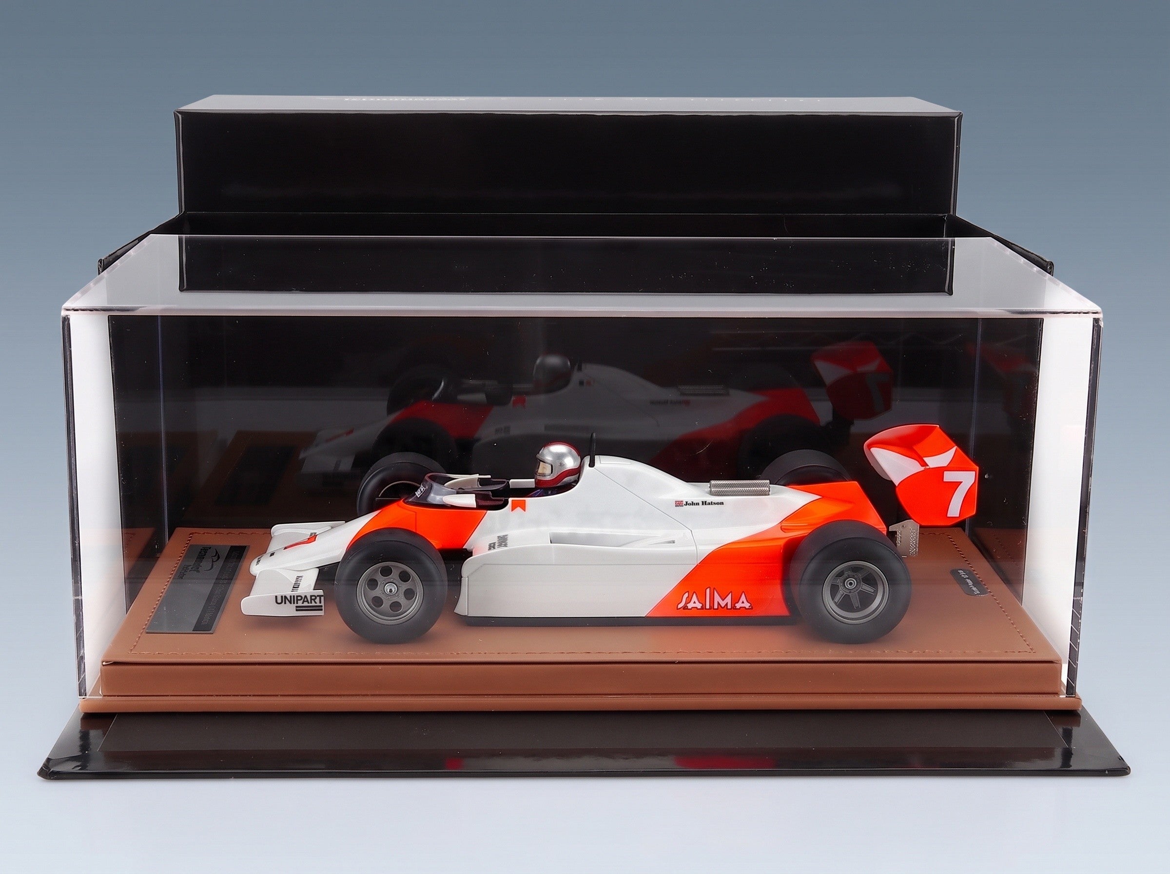 McLaren F1 MP4/1B Ford Cosworth No. 7 John Watson Monaco GP 1982 with Driver Tecnomodel 1:18 scale model - side view in display case