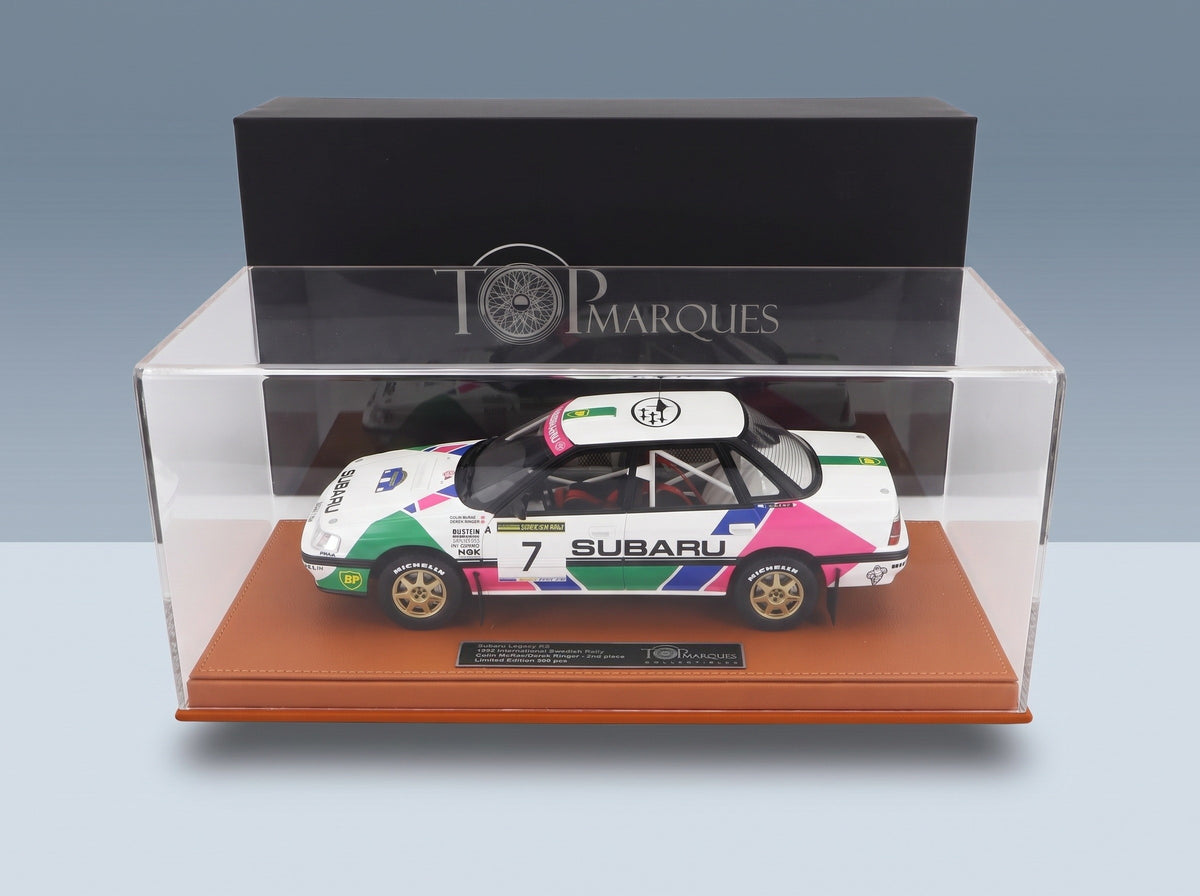 Subaru Legacy RS No. 7 2nd Swedish Rally 1992 Colin McRae Derek Ringer with Showcase Top Marques 1:18 scale model - side view in display case