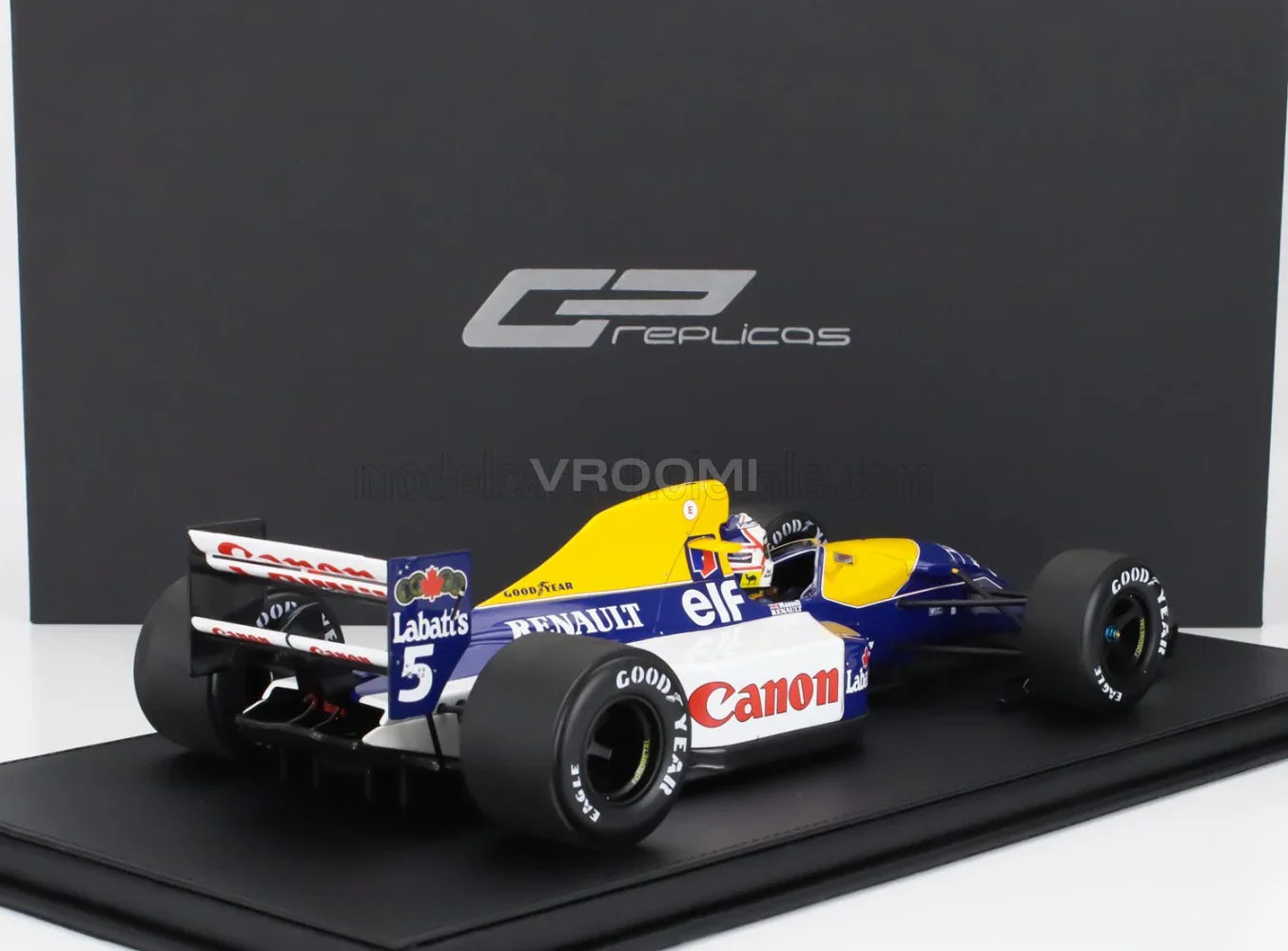 WILLIAMS - F1 FW14B RENAULT N° 5 : CHAMPION DU MONDE, POLE POSITION, MEILLEUR TOUR ET VAINQUEUR DU GP DE GRANDE-BRETAGNE (avec figurine du pilote) 1992 NIGEL MANSELL - BLEU, JAUNE, BLANC Maquette de voiture à l'échelle sur Vroomi