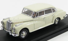 Cream vintage Mercedes-Benz model car on black base, classic design, available via Vroomi