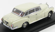 Cream vintage model car with chrome trim on black base, offered now through Vroomi platform
