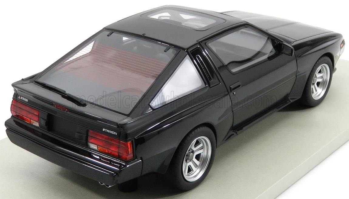 Black Mitsubishi Starion sports car model with sunroof and rear wiper, offered on Vroomi