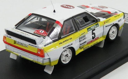 Scale model of Audi Quattro rally car with white, yellow, and red livery, available on Vroomi
