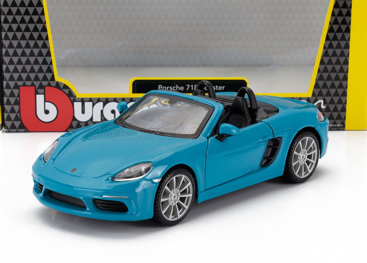 Maqueta a escala del Porsche 718 Boxster azul con interior detallado, presentada en un embalaje con la marca, disponible en Vroomi.