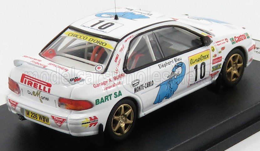 Modelo de coche de rally Subaru Impreza a escala 1/43, blanco con adhesivos de carreras, ya disponible en Vroomi.