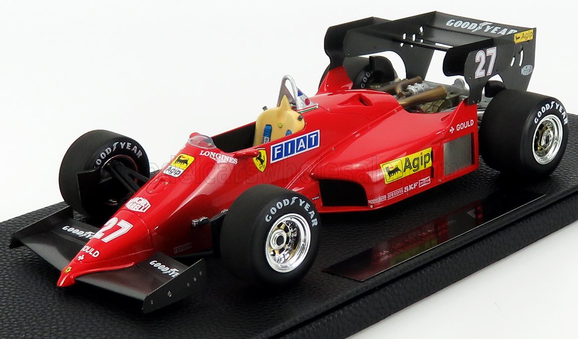 Modelo de coche de carreras Ferrari Fórmula 1 vintage rojo con neumáticos Goodyear y pegatinas de patrocinadores, disponible en Vroomi.
