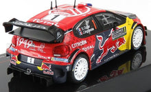 Modelo a escala 1/18 del coche de rally Citroën WRC con decoración de competición, disponible en Vroomi.