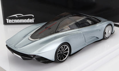 Silver Tecnomodel futuristic sports car scale model with black accents, showcased on a white platform, available via Vroomi