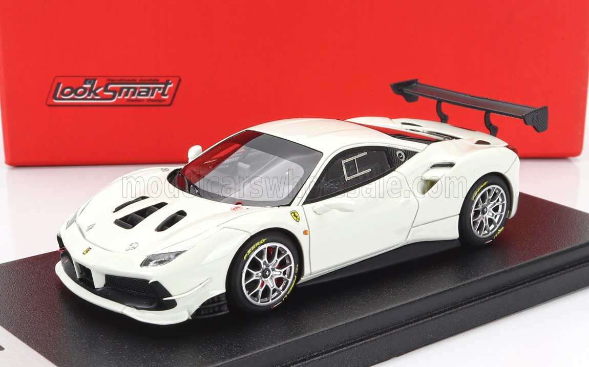 White Ferrari race car model with black rear wing displayed on black platform, available via Vroomi
