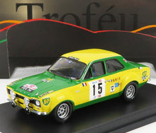 Green and yellow Ford Escort rally scale model car, racing decals, available for collectors on Vroomi.