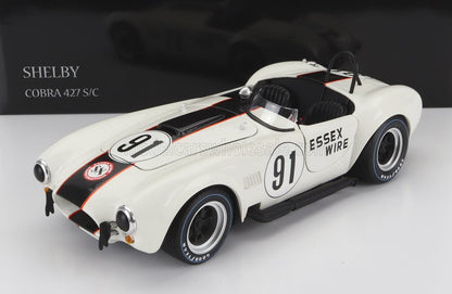 Coche modelo Shelby Cobra 427 S/C blanco con rayas negras de carreras, número 91 y logotipo de Essex Wire, disponible en Vroomi.