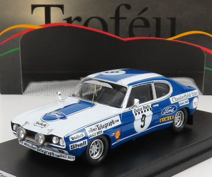 Modelo vintage azul y blanco de un coche de rally Ford con adhesivos de carreras y el número 9, a la venta en Vroomi.