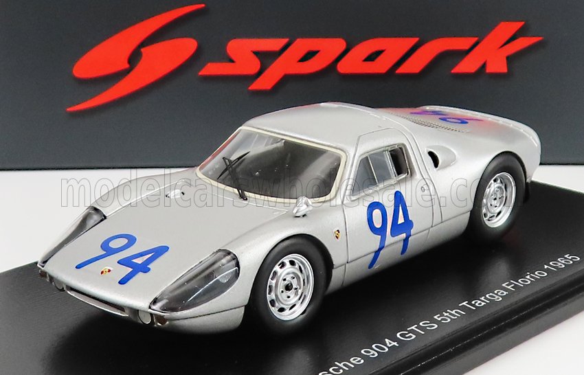 Silver Porsche 904 GTS scale model with blue number 94, displayed on black base, available on Vroomi