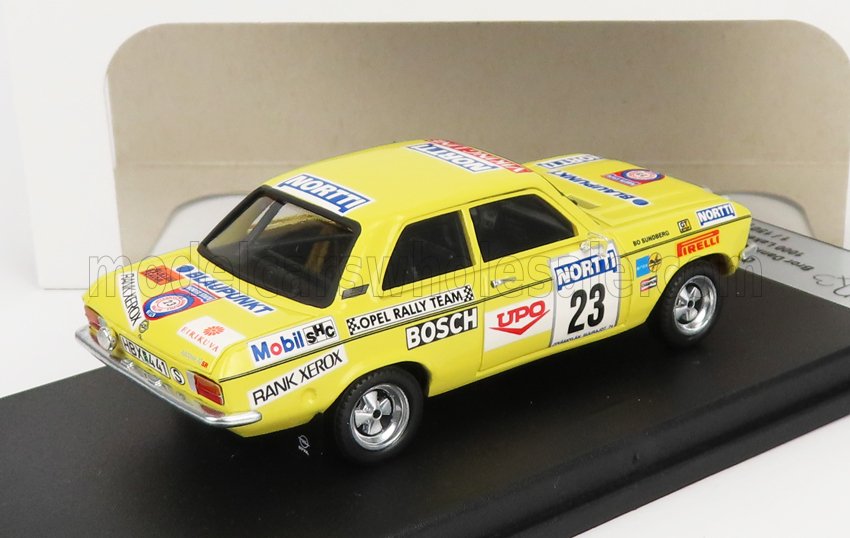 Modelo de coche de rally Opel amarillo con el número 23 y logotipos de patrocinadores, disponible en la plataforma Vroomi.
