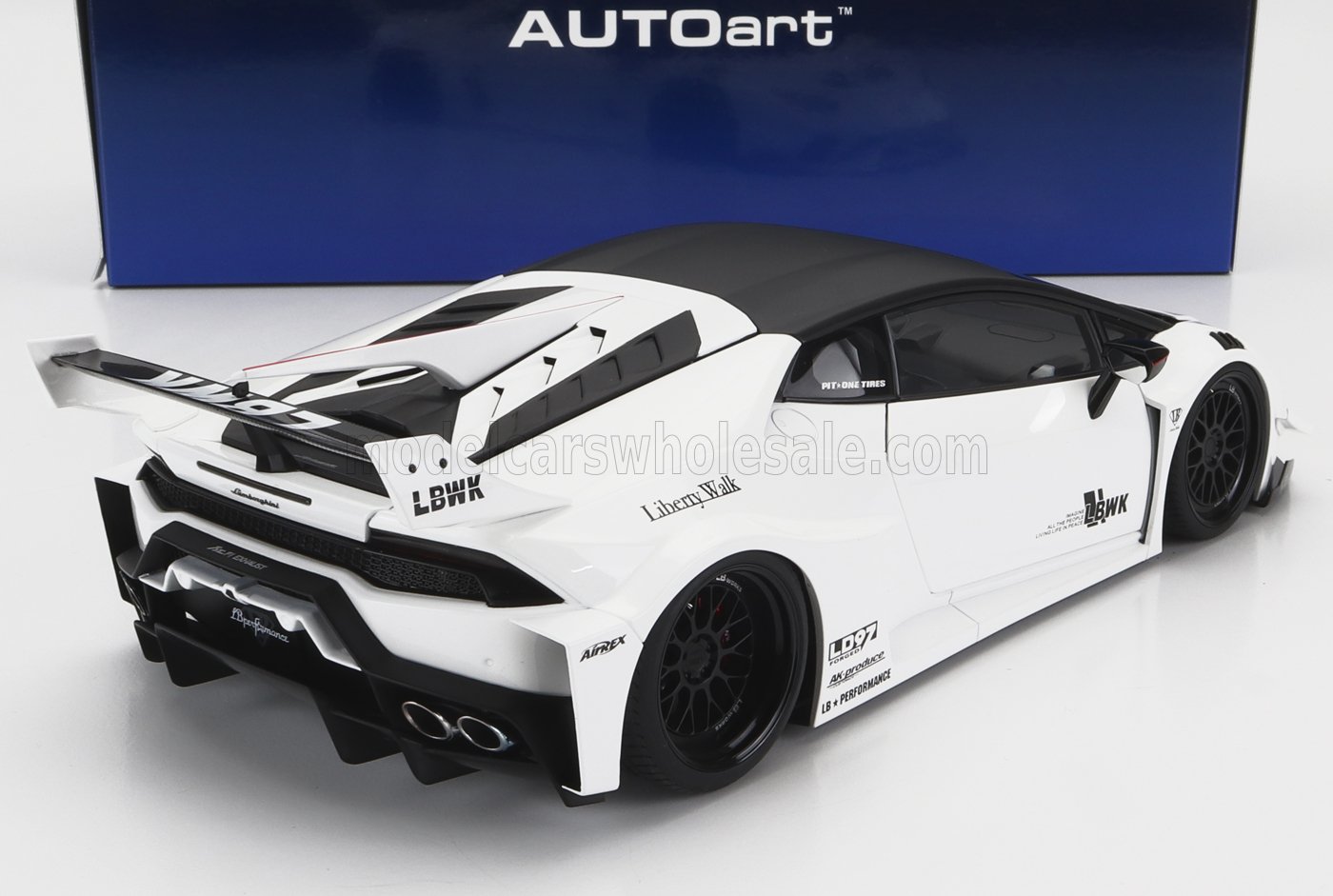 White Liberty Walk Lamborghini Huracan model with black roof and aerodynamic rear wing, available on Vroomi