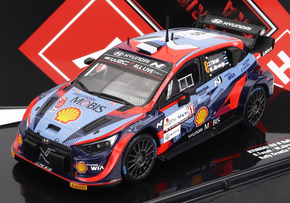 Coche de rally Hyundai WRC a escala 1/18 con logotipos de patrocinadores, disponible en Vroomi.