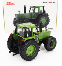 Maqueta detallada del tractor Hürlimann H-6130 en color verde de Schuco con neumáticos grandes, disponible en Vroomi.