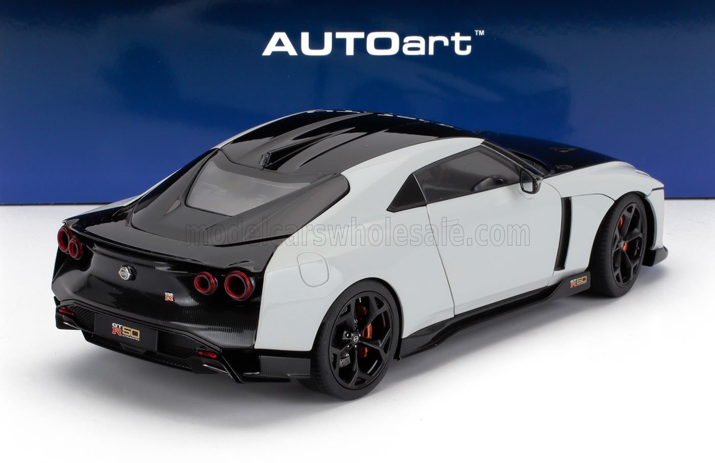 AUTOart Nissan GT-R50 model car in black and white, available on Vroomi platform
