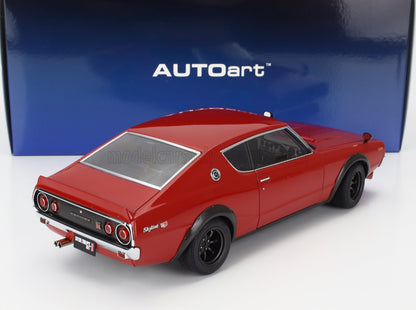 Red Nissan Skyline 2000 GT-R scale model by AUTOart with black wheels, shown on white surface, available on Vroomi platform