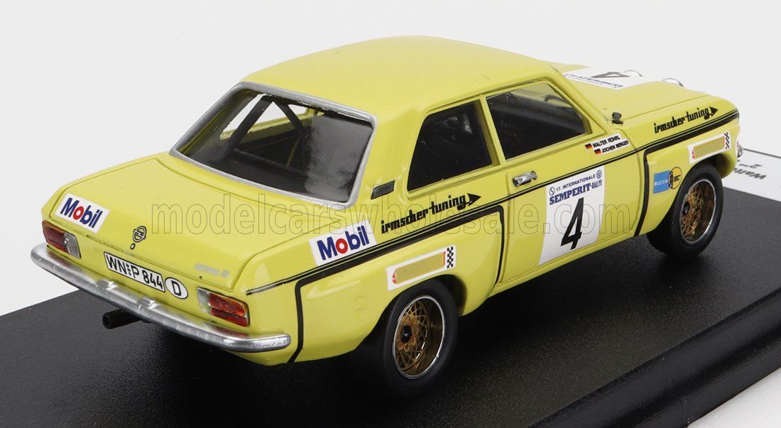 Yellow vintage racing model car with Mobil logos, number 4 decals, and gold wheels, offered on Vroomi