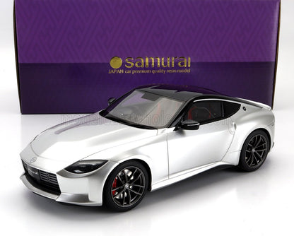 Silver resin model of Nissan Fairlady Z sports car with black roof, displayed with purple Samurai box, available on Vroomi