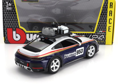 Modelo a escala de Porsche 953 con portaequipajes en el techo, calcomanía de carreras azul marino y blanca, disponible en Vroomi.